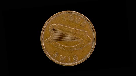 ireland 1964 halfpenny coin obverse with irish harp and date rotating on black background