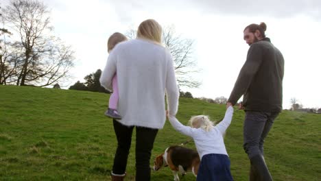 family on winter country walk with pet dog shot on r3d