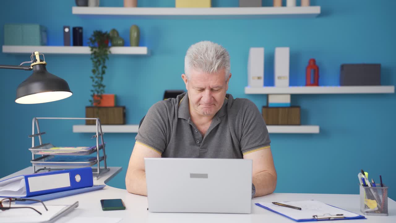 Home office worker in cheerful mood.