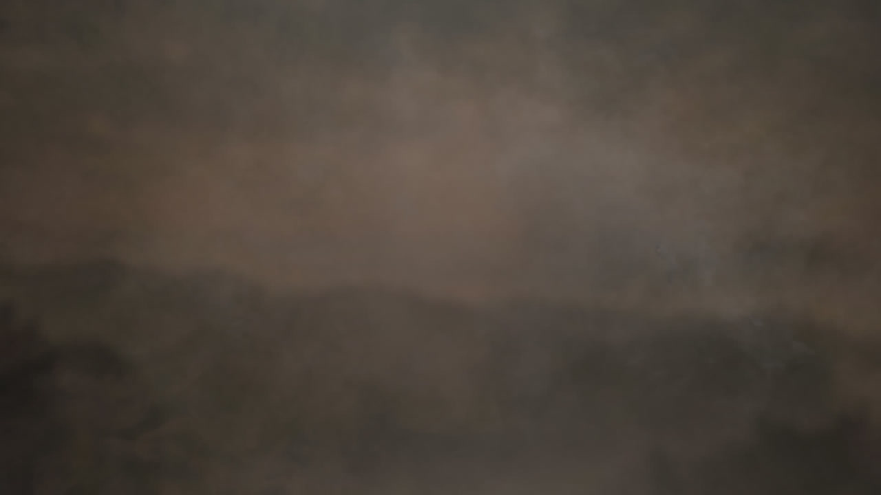 회색 배경에 대해 움직이는 연기가 있는 불 공