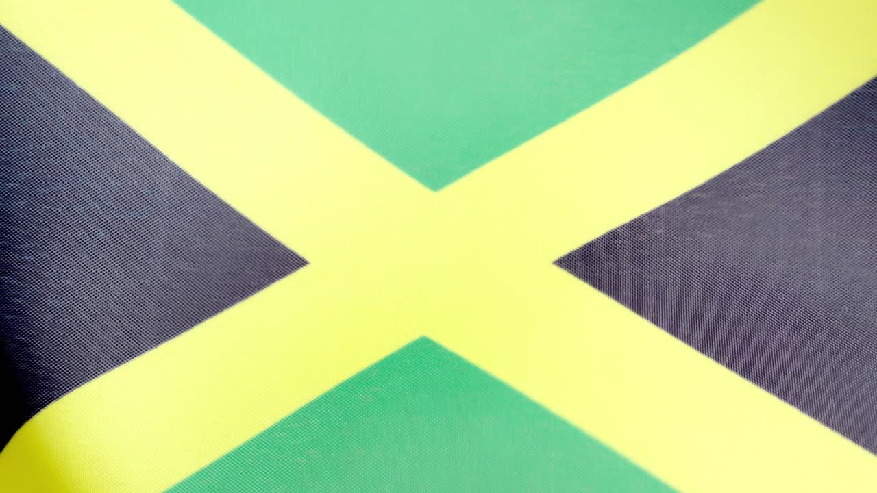 Jamaican national flag waving by the wind