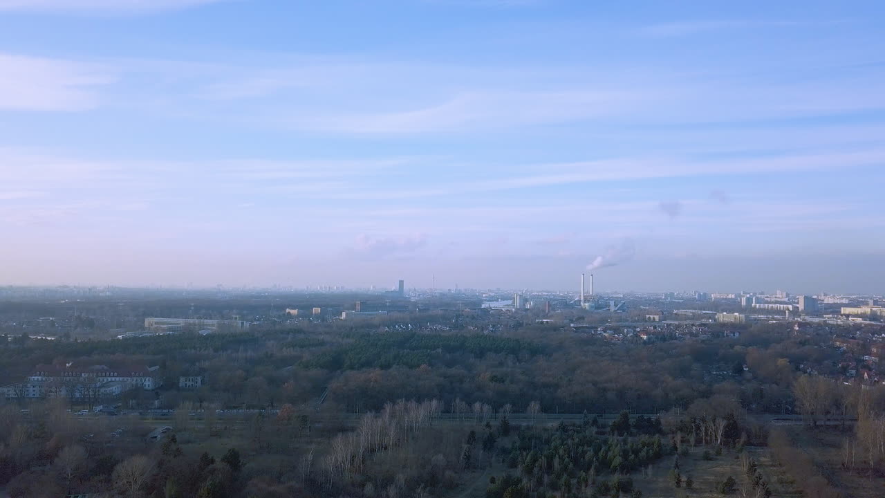 Aerial View of Berlin Cityscape with Forest and Industrial Area
