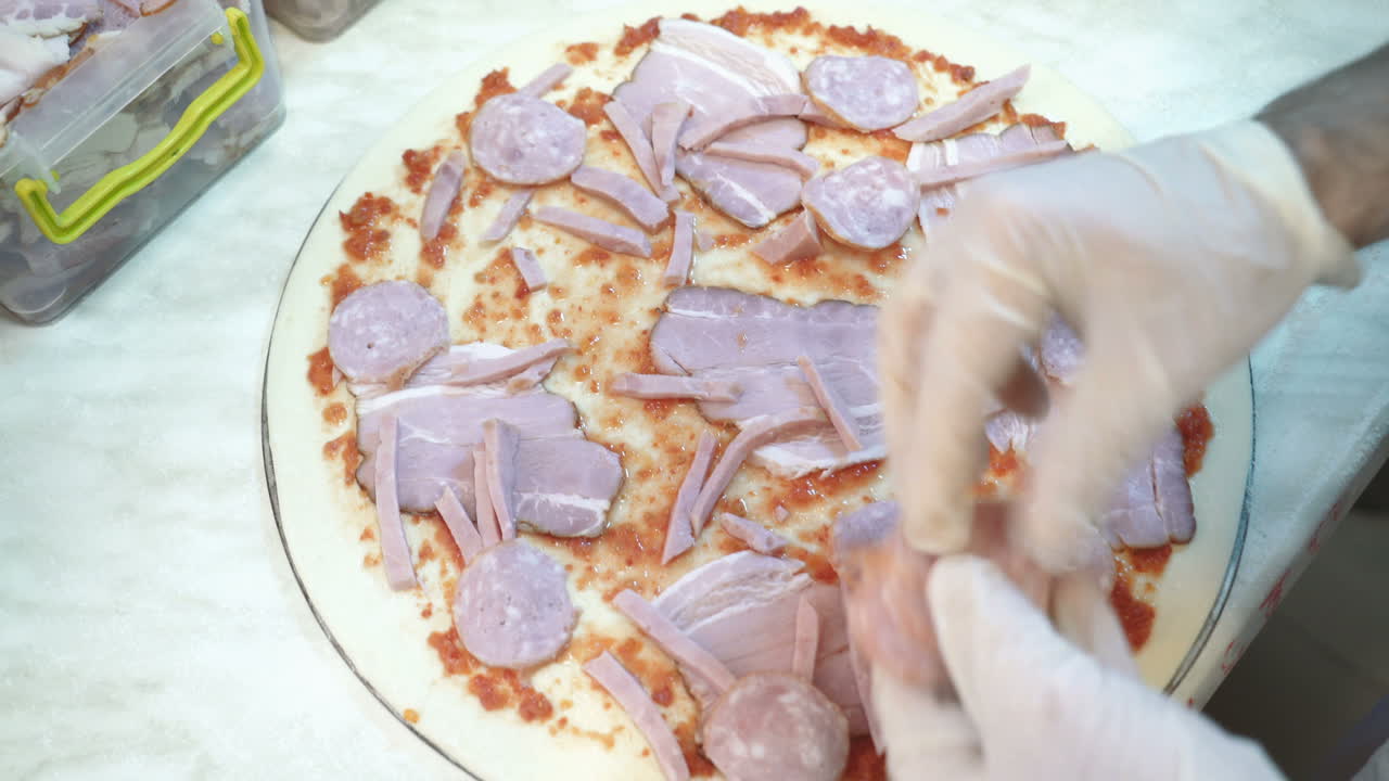 Fresh original Italian raw pizza, preparation in traditional style.