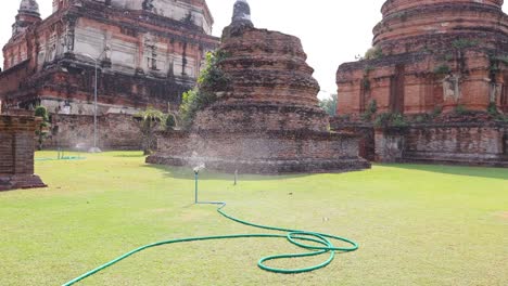 sprinkler system irrigates grass at historic site