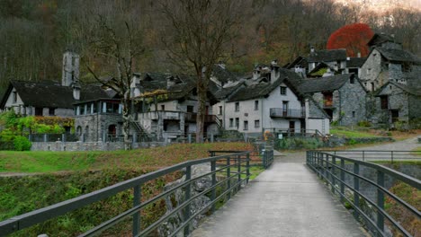 Panning-from-the-left-to-the-right-side-of-the-frame-at-the-stone-houses-in-the-village-in-Cavergno,-located-in-the-district-of-Vallemaggia,-in-Switzerland