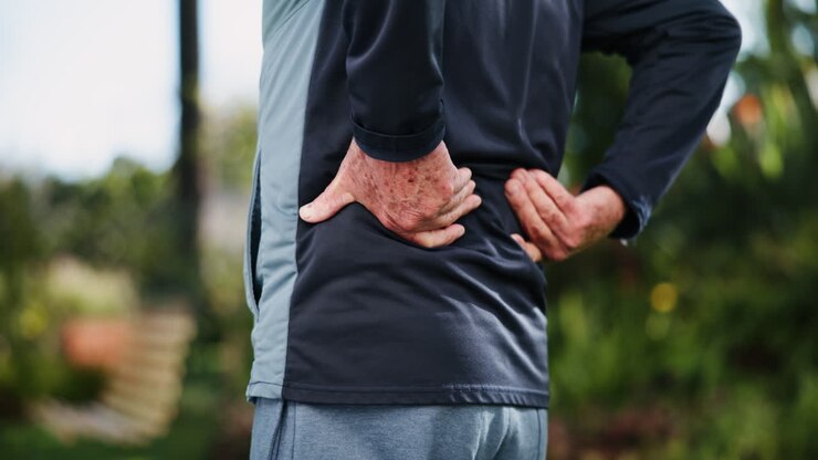 Senior man experiencing back pain
