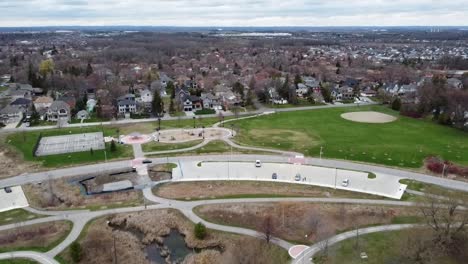 drone tilting up over lakeside neighborhood in the spring