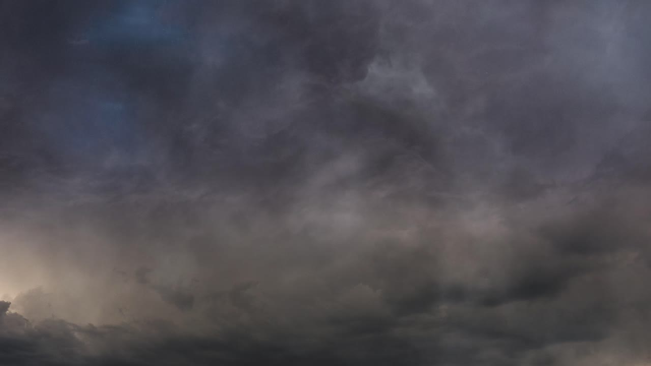dark clouds and thunderstorm at dusk