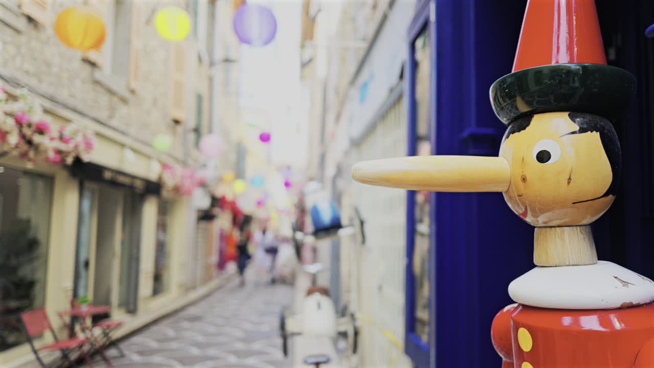 Pinocchio sculpture made out of wood on the streets of Antibes, France