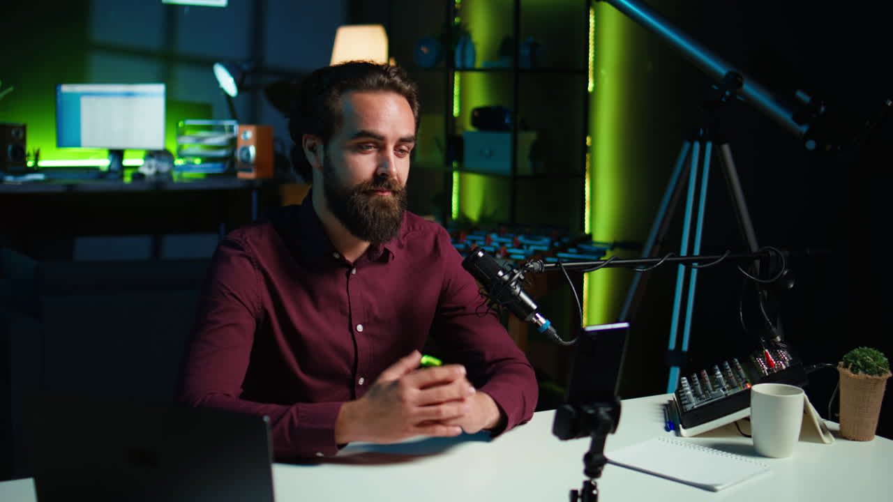 Media star talking in front on smartphone attached to tripod stabilizer