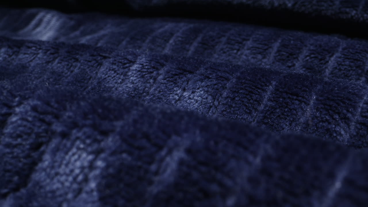 Close-up of a dark blue plush fabric