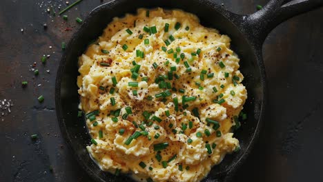 Scrambled-Eggs-Garnished-with-Chives-in-a-Cast-Iron-Pan