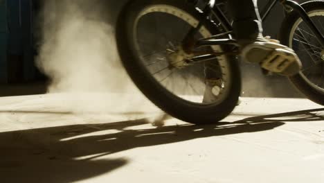 bmx rider in an empty warehouse