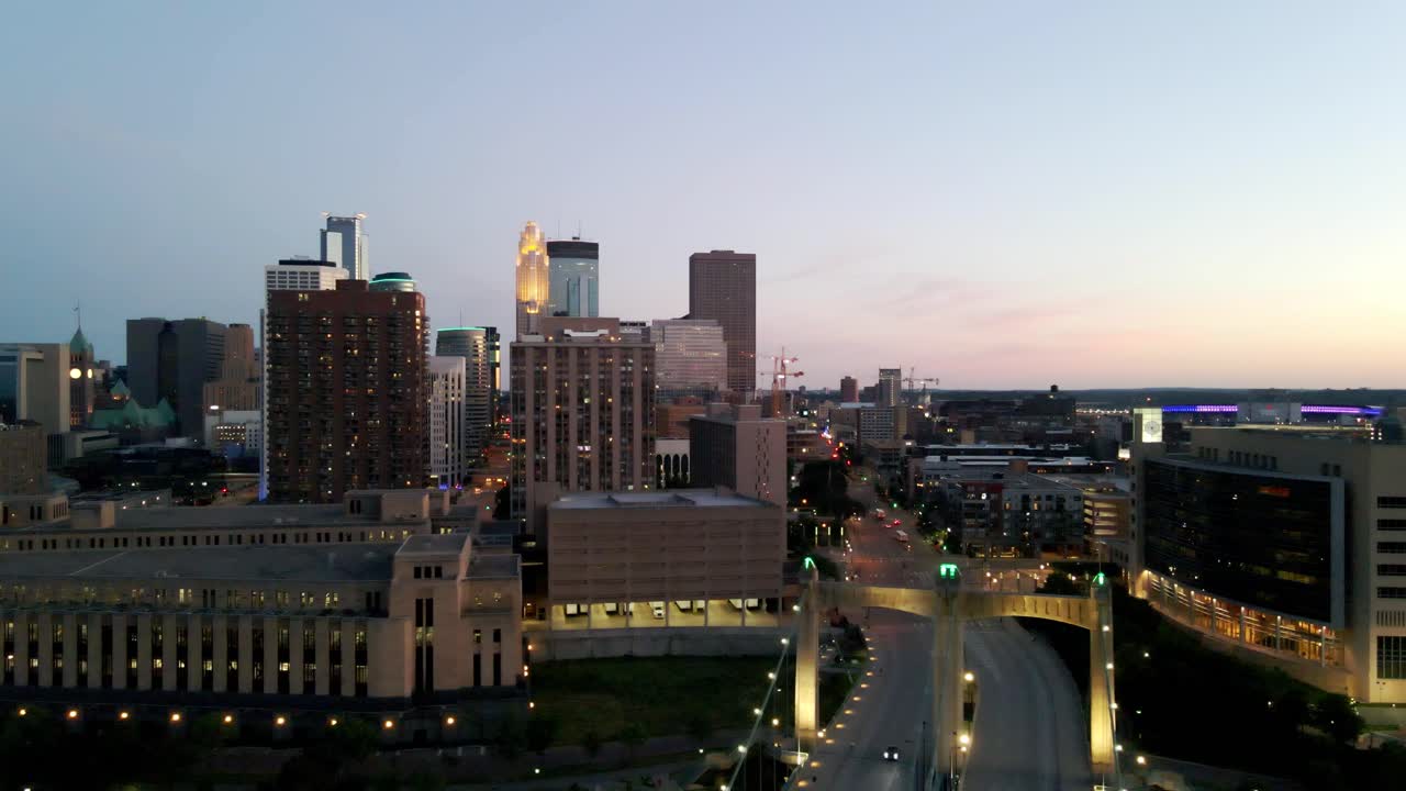 aerial view of minneapolis skyline in the background from hennepin bridge