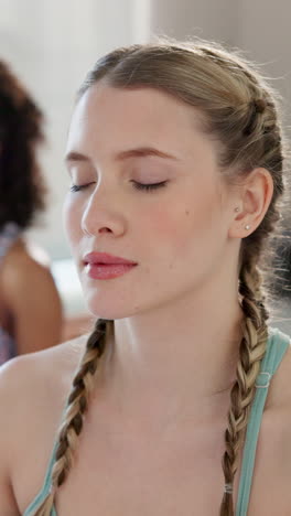 woman practicing yoga and meditation in a studio