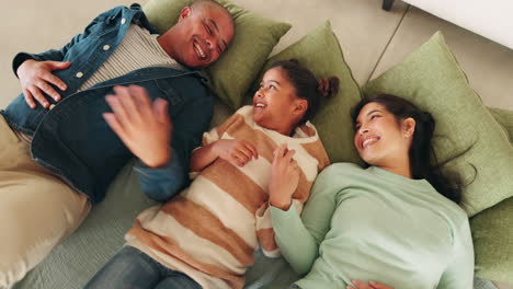 Home,-family-and-holding-hands-in-living-room