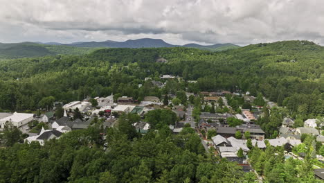 highlands north carolina aerial v2 cinematic birds eye view drone flyover mountain town capturing the main street activity and beautiful lush rolling mountainscape - shot with mavic 3 cine - july 2022