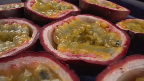 juicy rotating passion fruits close up, tropical maracuya, tasty exotic fruit, 4k macro shot