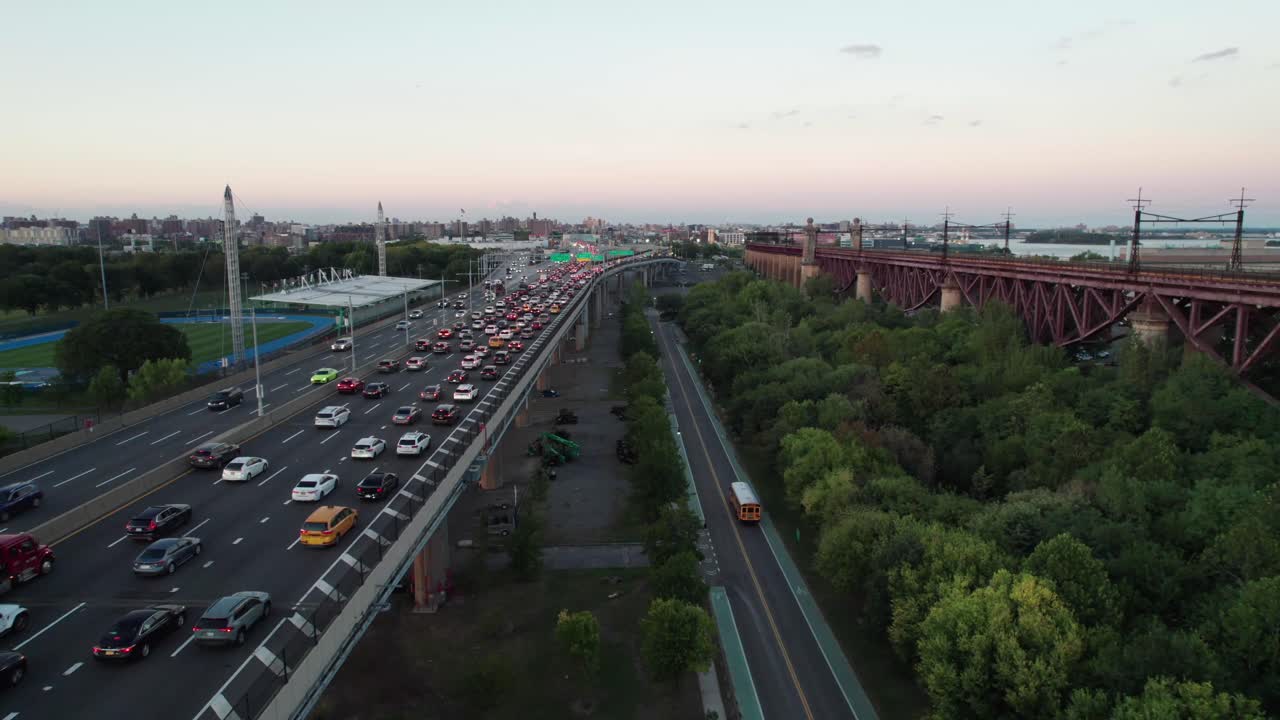 Randalls Island, NYC, with traffic on the Triboro Bridge Expressay, 4K aerial