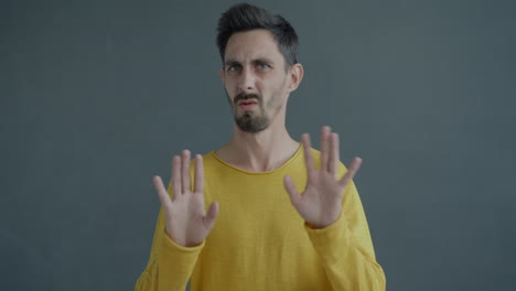 man with a disapproving expression