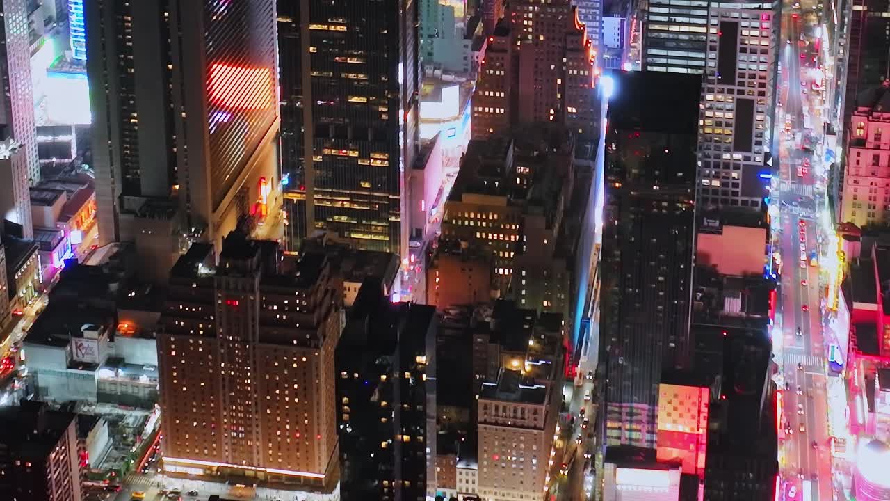 Vibrant lights illuminate New York City skyline from above at night