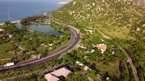 Aerial-View-Of-Coastal-Road-AH1-Highway-Near-Ca-Na-In-Binh-Thuan,-Vietnam-At-Daytime