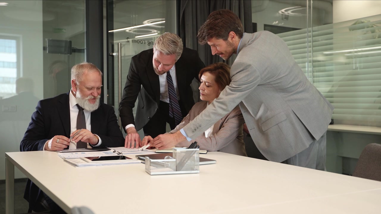 Business Team Discussing Documents and Collaborating in a Modern Office Meeting