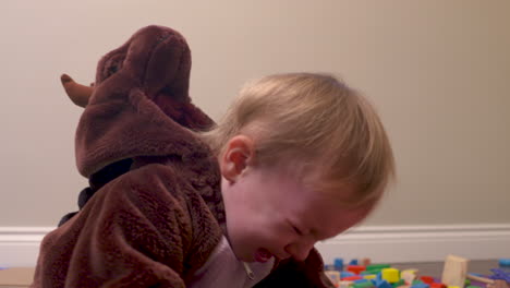 unhappy toddler boy starts to throw a temper tantrum