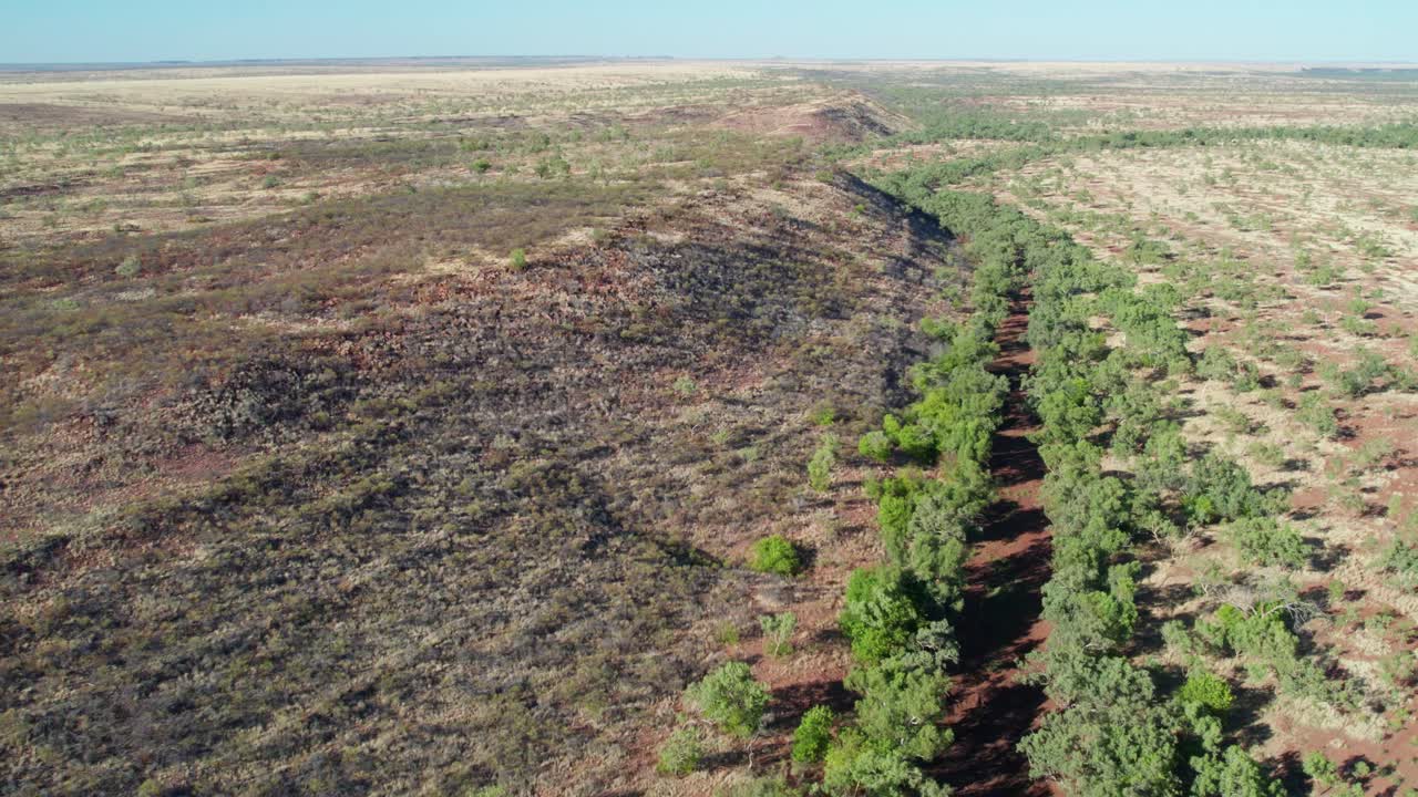 Sideways drone view of the Victoria River and landscape near Kalkarindji, Gurindji, Northern Territory, Australia, August 2022.
