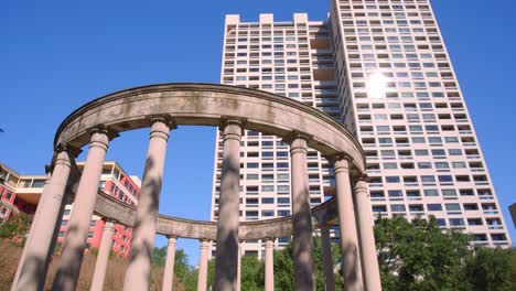 low angle view of the mecom rockwell coloonnade monument in houston museum district