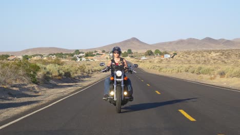 woman motorcyclist with dog