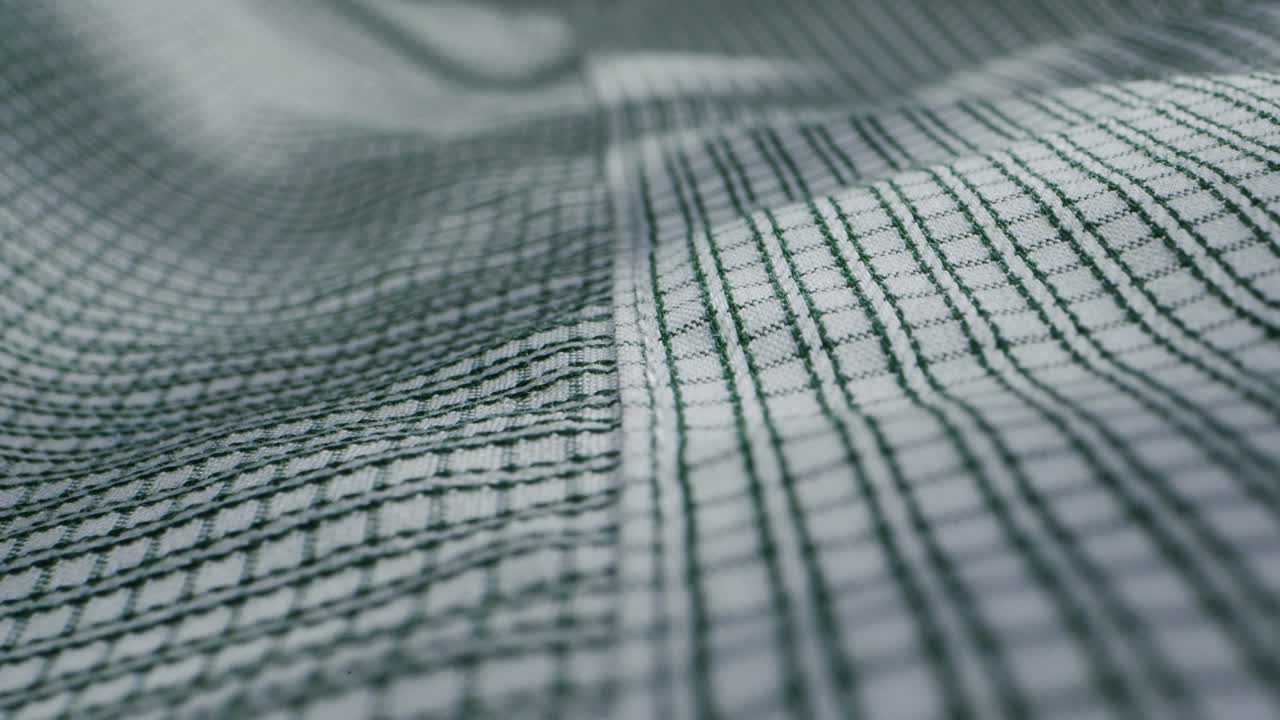 Closeup of an expertly tailored suit that beautifully showcases its sophisticated buttons and fine fabric texture