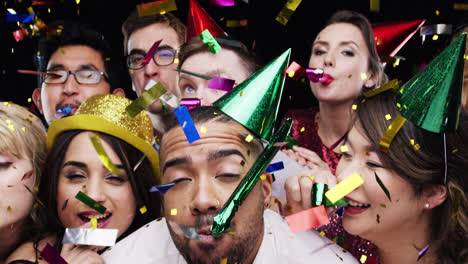 multi-ethnic group of people celebrating birthday party slow motion photo booth