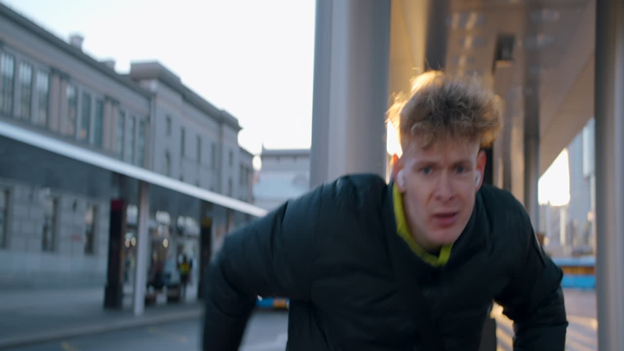 Young Man Waiting at a Bus Stop