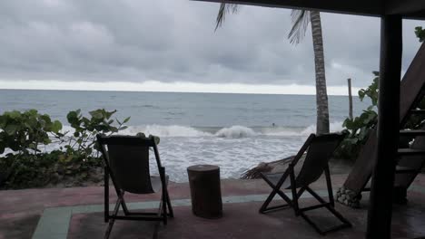 pan shot of the beach between chairs
