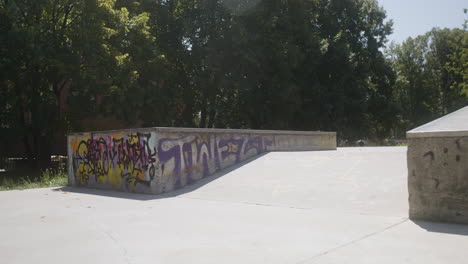 boy's feet on skateboard in skatepark.