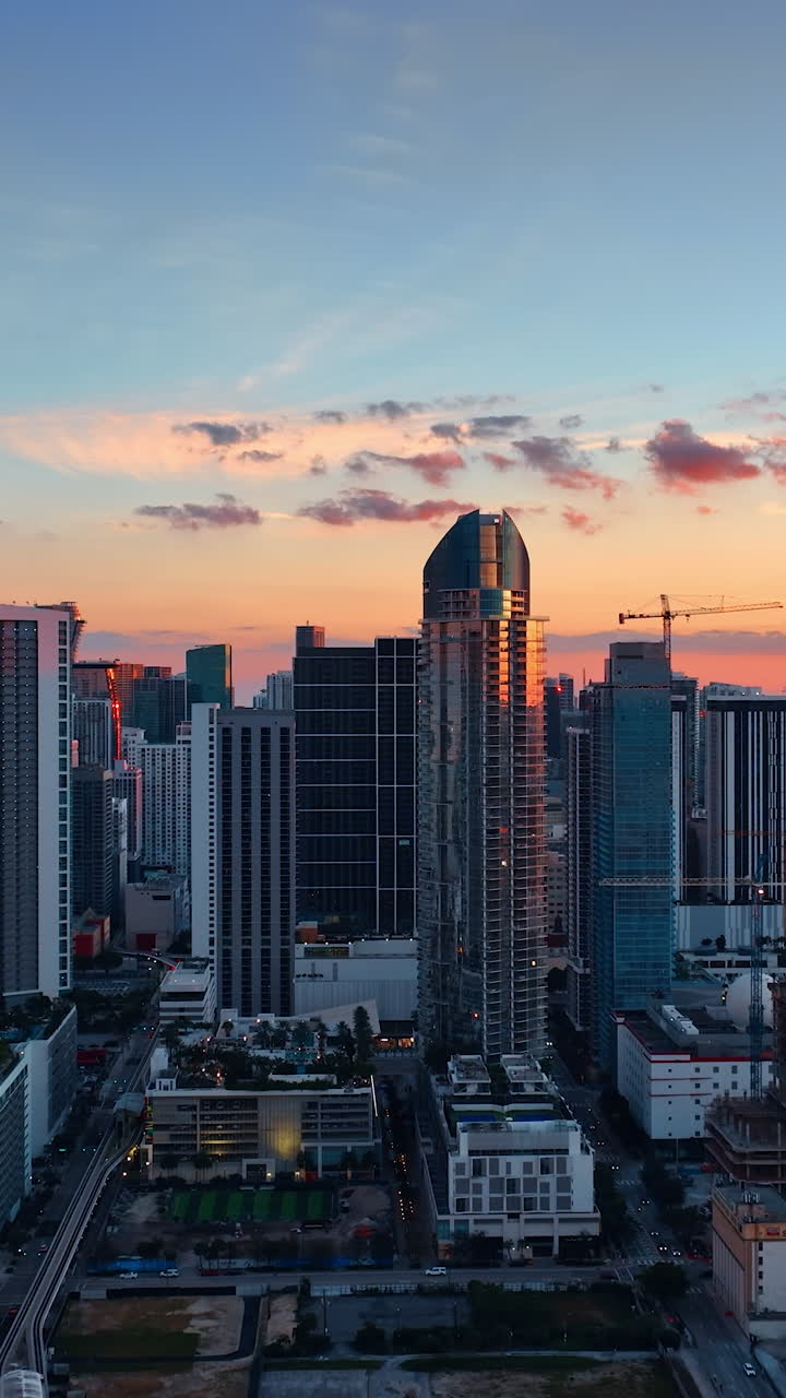 Skyscrapers in the rays of setting sun. Miami downtown at the backdrop ...