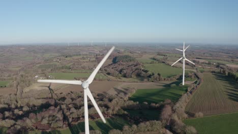 an array of spinning power generating windmills stretches off into the distance