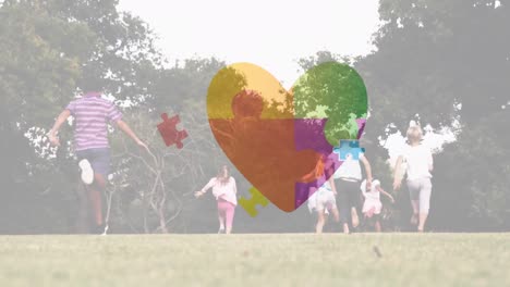 Animation of puzzle and heart over diverse schoolchildren running