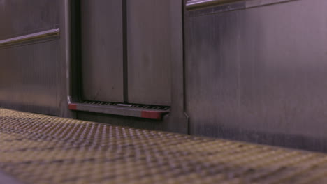 nyc subway train people's feet getting off the train - new york city. slowmotion