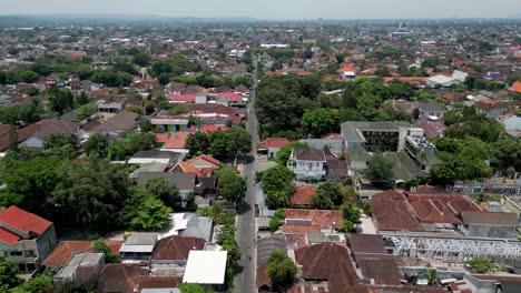 neighborhood full of houses and trees in yogyakarta at day time