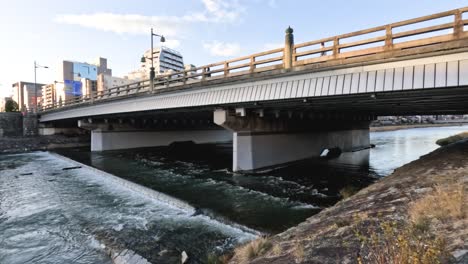 bridge spanning river in urban setting