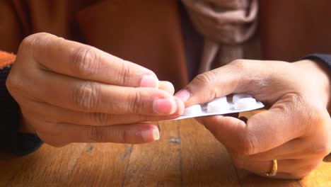 woman taking pills