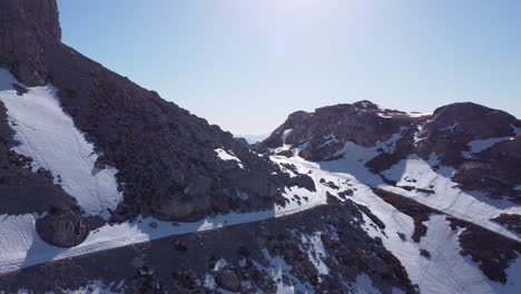 Anonymous-person-running-on-Picos-de-Europa-mountains-covered-with-snow