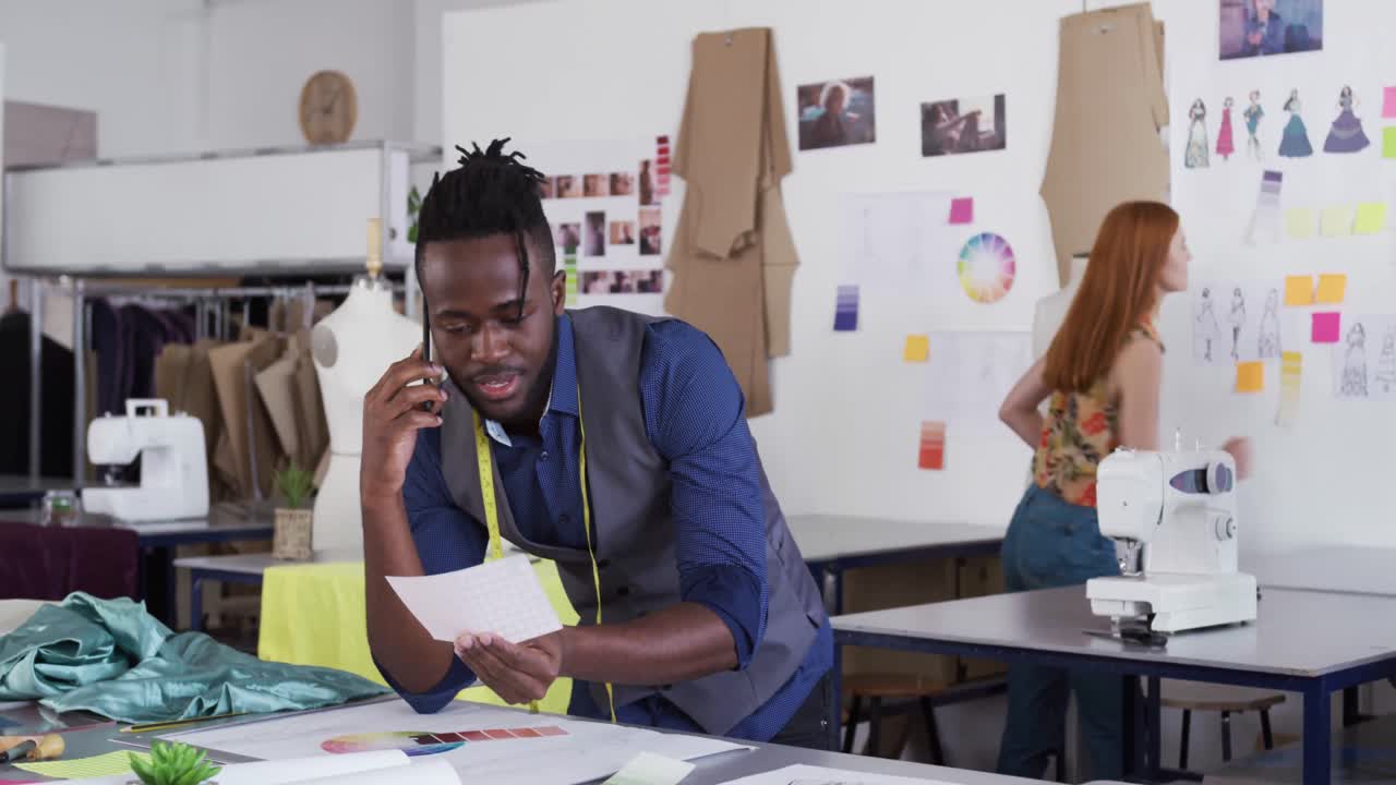 Mixed race man working in creative office