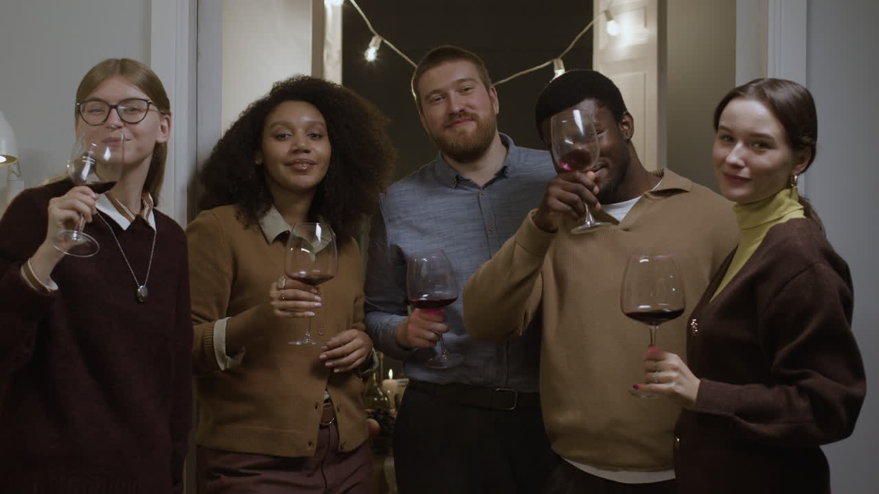 People toasting with wine glasses