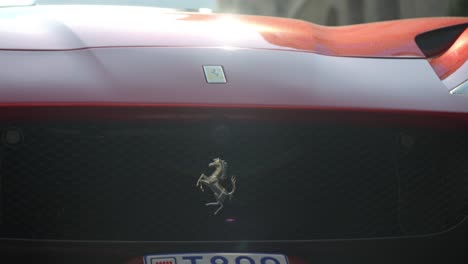 close-up of a red ferrari with monaco license plate