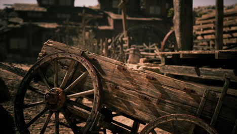 weathered wooden cart in a rustic western town at dusk