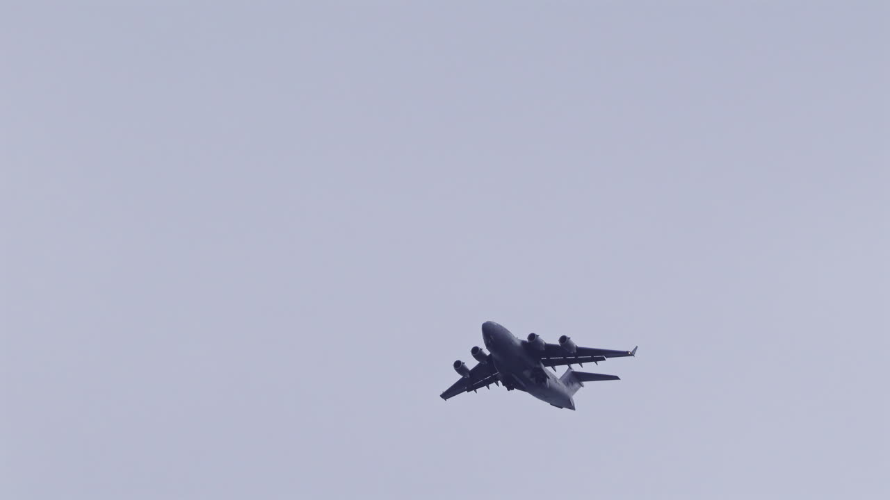 Antibes, France - May 8, 2025: View of an airplane flying on the cloudy sky in the evening