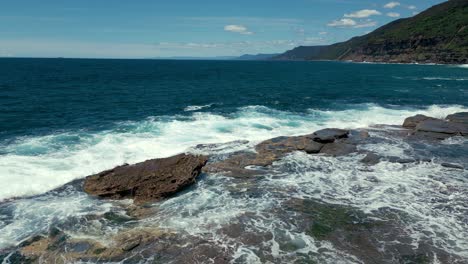 Drone-aerial-view-of-cinematic-scenic-seaside-rock-shelf-fairy-pool-in-4K-UHD